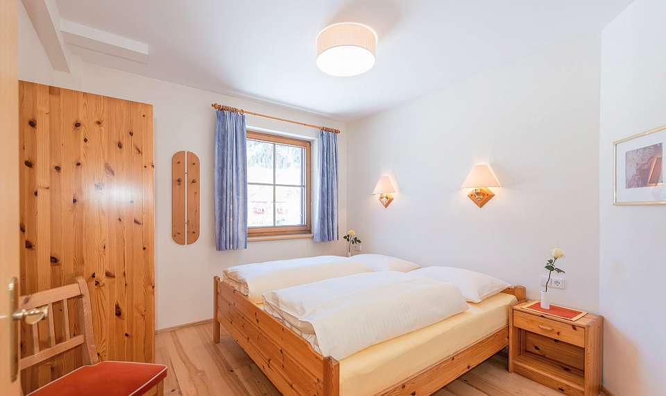 Apartmajska hiša Vital Schladming - SKIFUN - spalnica z zakonsko posteljo